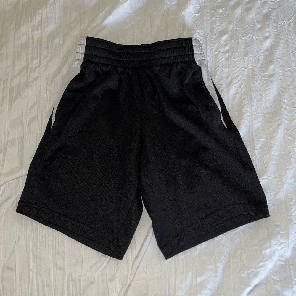 BOYS M (8) athletic black shorts with white detailing.